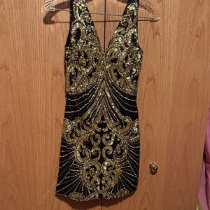Claudine cocktail dress in gold sequins.